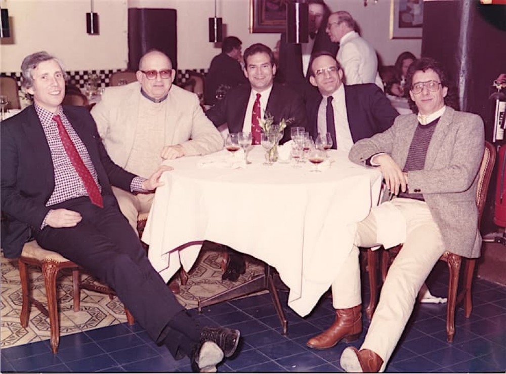 Jerome Baumring (second from right) and Donald Mack (second from left) attending a dinner with colleagues. Circa 1983
